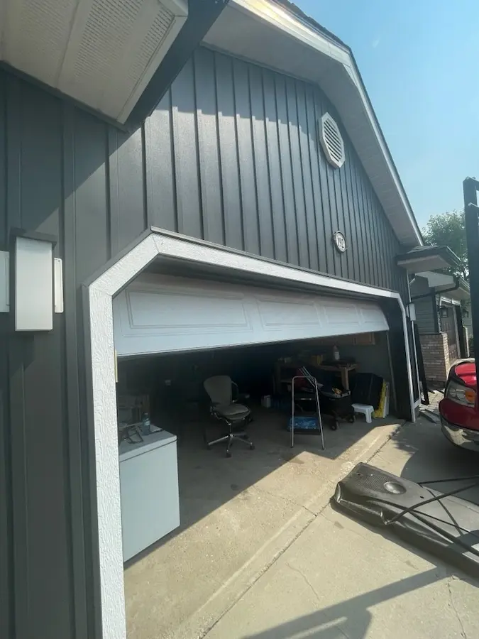 Premium wood siding installation on garage in Calgary by Peakline Roofing & Exteriors