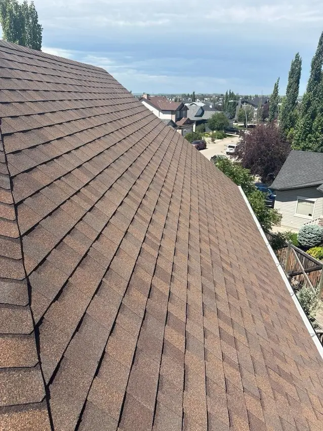 Expert roof replacement service by Peakline Roofing & Exteriors with comprehensive warranty and professional installation in Calgary